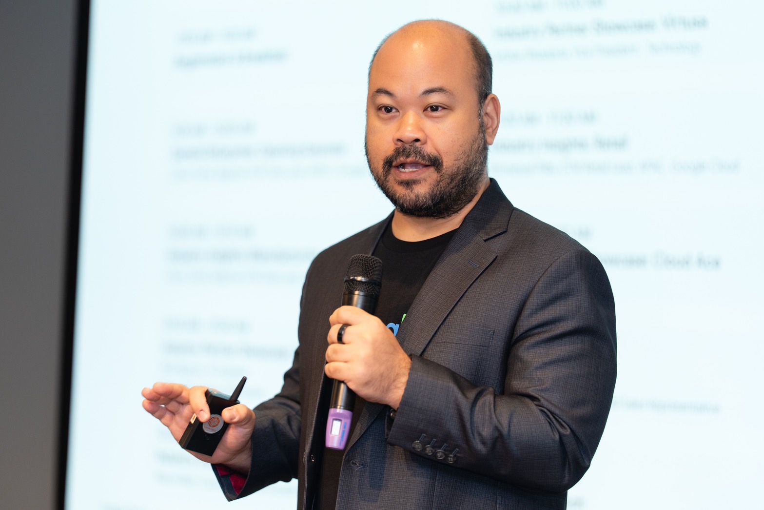 Chom Trevai speaking at a Google Cloud event